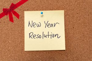 Image of a sticky note that says New Year Resolution